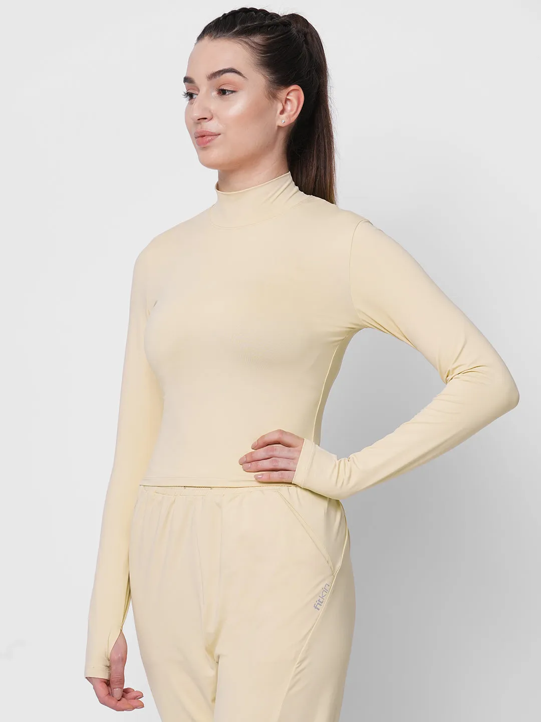 Fitkin women cream high neck fitted tshirt